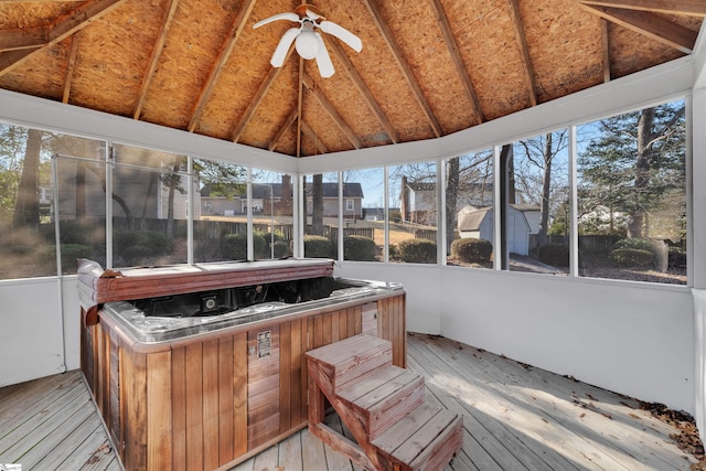sunroom / solarium with ceiling fan, lofted ceiling, and a jacuzzi