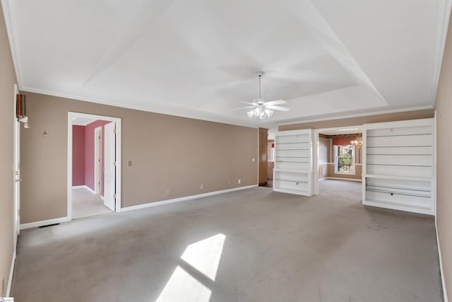unfurnished living room with ceiling fan, light colored carpet, ornamental molding, and a tray ceiling