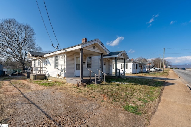 view of front of property featuring covered porch