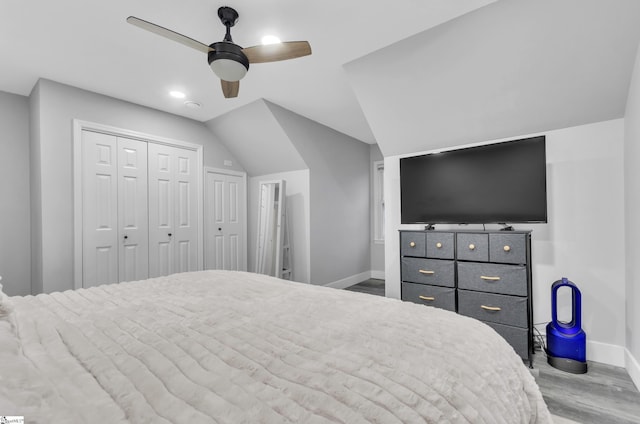 bedroom featuring ceiling fan, lofted ceiling, light hardwood / wood-style floors, and a closet