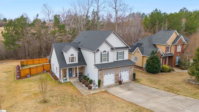 view of front of house with a garage and a front lawn