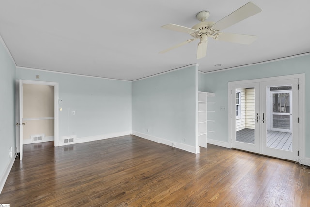 unfurnished room featuring ornamental molding, dark hardwood / wood-style floors, ceiling fan, and french doors