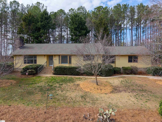 ranch-style house featuring a front lawn