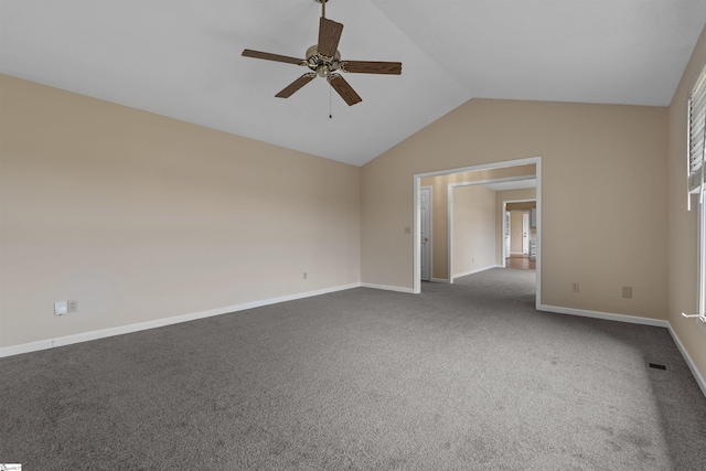 carpeted spare room featuring lofted ceiling and ceiling fan