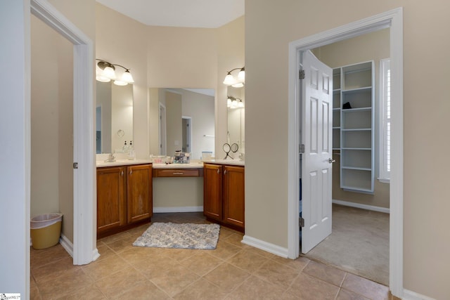 bathroom with vanity and tile patterned flooring