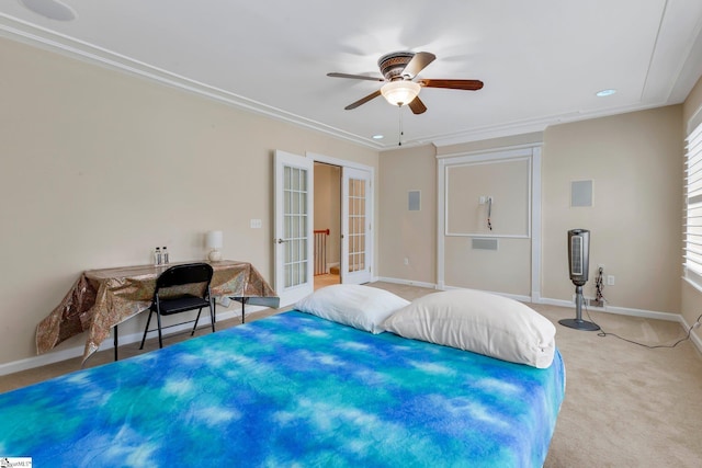 bedroom with ornamental molding, light carpet, ceiling fan, and french doors