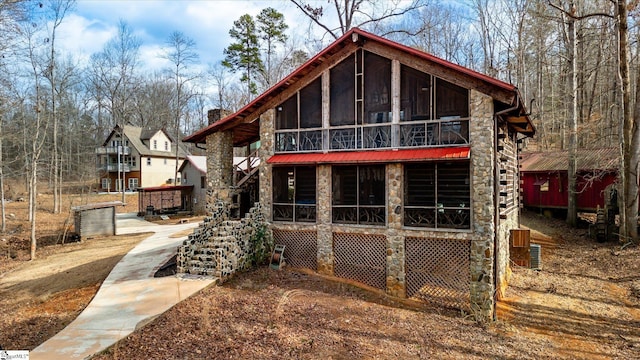 rear view of house with a sunroom