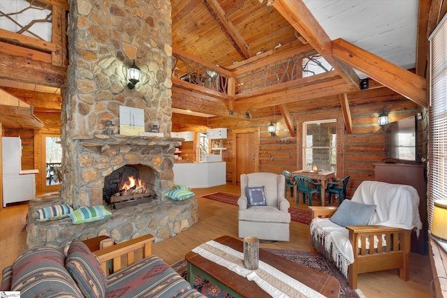 living room featuring wood ceiling, rustic walls, wood-type flooring, a stone fireplace, and beamed ceiling