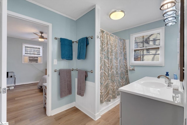 bathroom featuring cooling unit, shower / tub combo, vanity, wood-type flooring, and ornamental molding