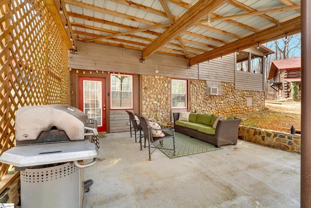 view of patio / terrace featuring an outdoor living space and a grill