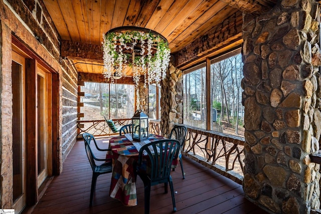 unfurnished sunroom with a chandelier and wood ceiling