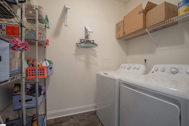 clothes washing area featuring washer and dryer and dark hardwood / wood-style floors