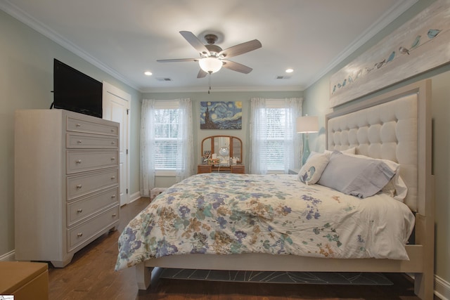 bedroom with multiple windows, hardwood / wood-style floors, crown molding, and ceiling fan