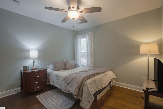 bedroom with dark wood-type flooring and ceiling fan