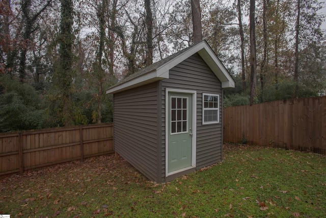 view of outbuilding with a lawn