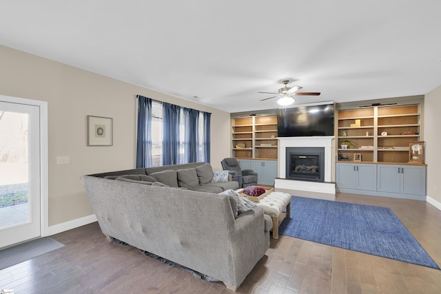 living room with hardwood / wood-style flooring and ceiling fan