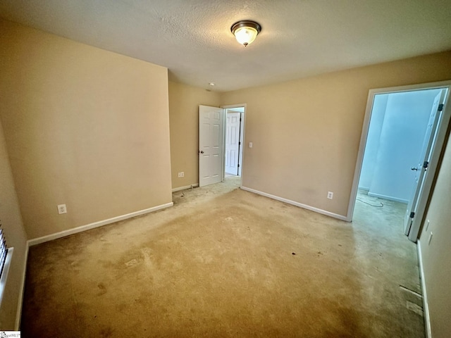 spare room with a textured ceiling