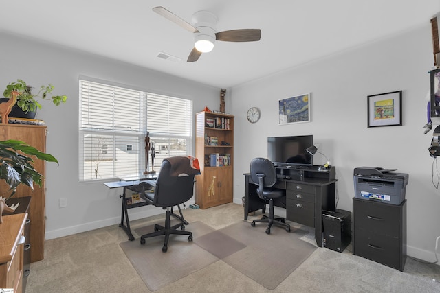 carpeted office featuring ceiling fan