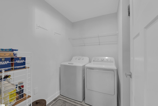 clothes washing area featuring washing machine and clothes dryer