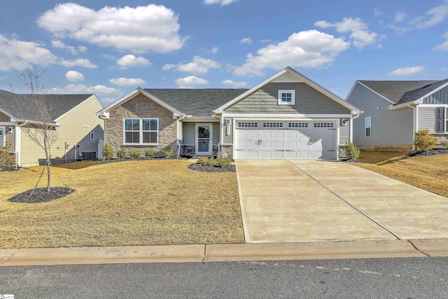 view of front of home featuring a garage and a front lawn