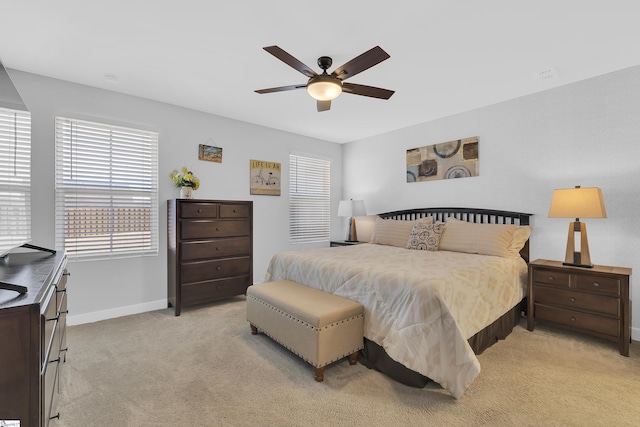 bedroom with light carpet and ceiling fan