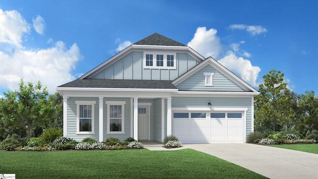 view of front of house featuring a garage and a front lawn