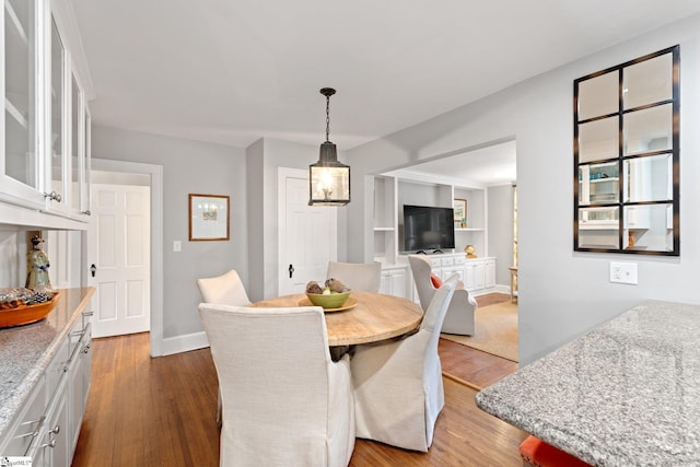 dining room with dark hardwood / wood-style flooring