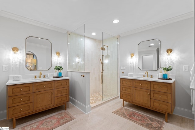 bathroom with ornamental molding, tiled shower, and vanity