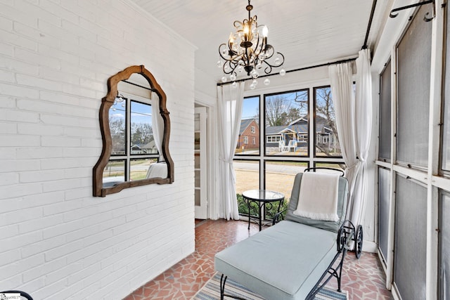 sunroom with a chandelier