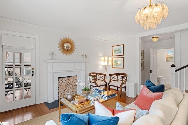 living room featuring wood-type flooring and a notable chandelier