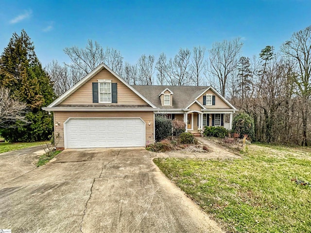 view of front of home featuring a garage and a front lawn