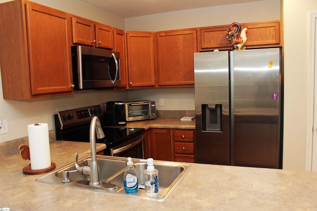 14 Heatherfield Dr, Simpsonville, SC 29680 - kitchen with stainless steel appliances, brown cabinets, and light countertops