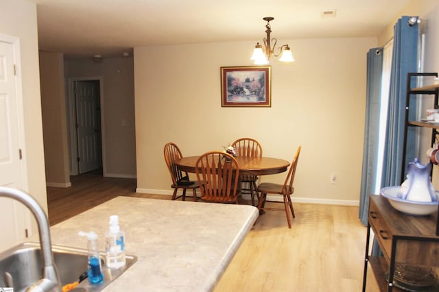 14 Heatherfield Dr, Simpsonville, SC 29680 - dining space featuring a chandelier, light wood-style floors, baseboards, and visible vents