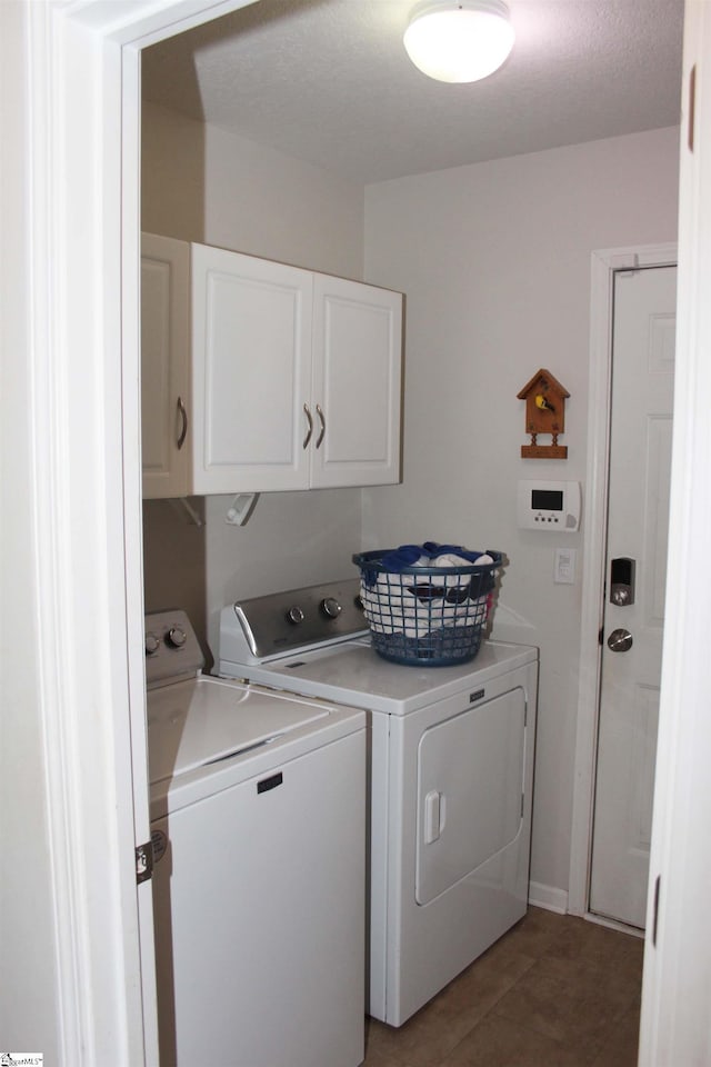 14 Heatherfield Dr, Simpsonville, SC 29680 - washroom featuring washer and dryer, light tile patterned floors, and cabinet space
