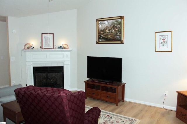 14 Heatherfield Dr, Simpsonville, SC 29680 - living room with a tiled fireplace, baseboards, and wood finished floors