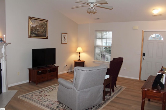 14 Heatherfield Dr, Simpsonville, SC 29680 - living area featuring baseboards, vaulted ceiling, a ceiling fan, light wood-style floors, and visible vents