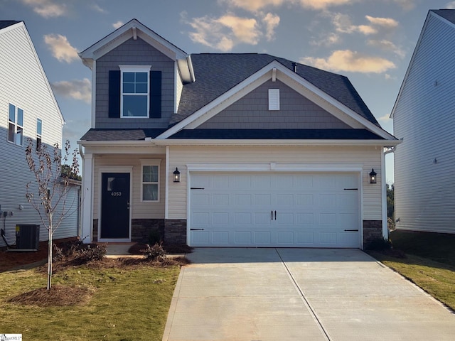 craftsman-style home with a garage and a front lawn