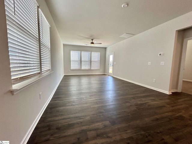 empty room featuring dark hardwood / wood-style floors and ceiling fan