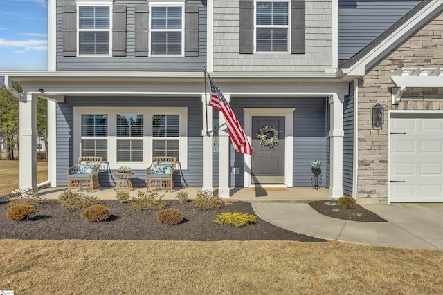 view of exterior entry featuring a garage