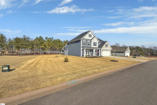 view of front facade with a garage and a front lawn