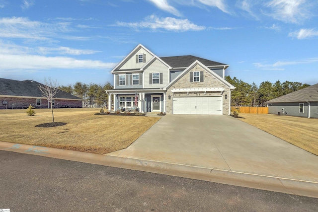 craftsman-style house with a garage, a front lawn, and a porch