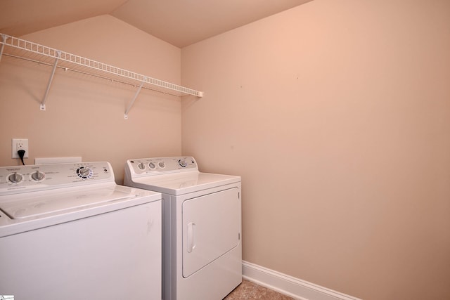 laundry area with washing machine and clothes dryer