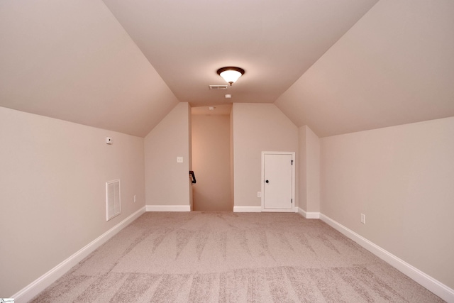 additional living space with lofted ceiling and carpet floors