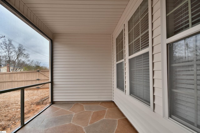 unfurnished sunroom featuring wooden ceiling