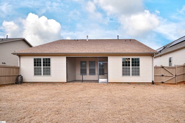 back of property featuring a sunroom