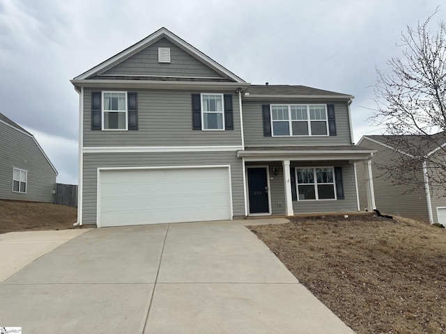 front of property with a garage