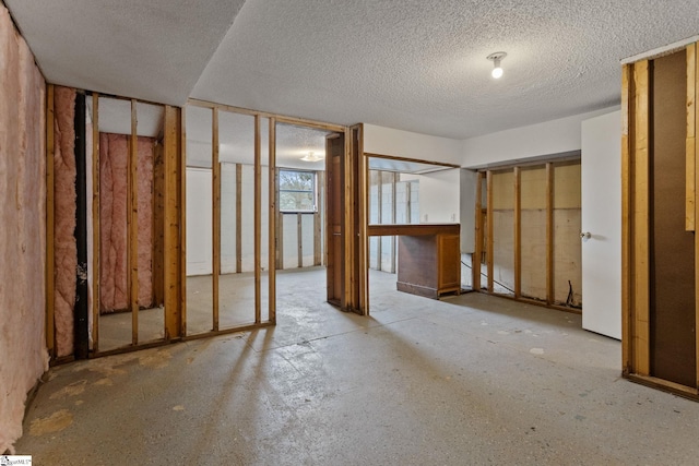 interior space with a textured ceiling