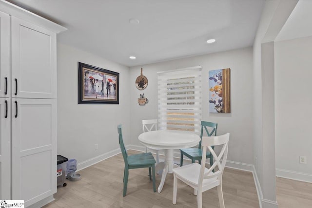 dining area with light wood-type flooring