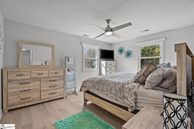 bedroom featuring ceiling fan and light hardwood / wood-style floors