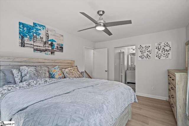 bedroom with ensuite bathroom, ceiling fan, and light wood-type flooring